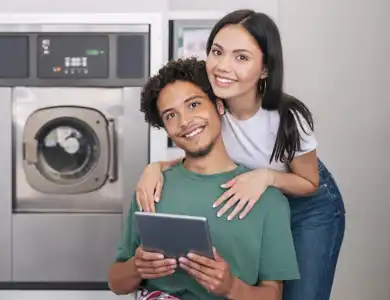 Happy Laundromat Copule Shutterstock 2313678297